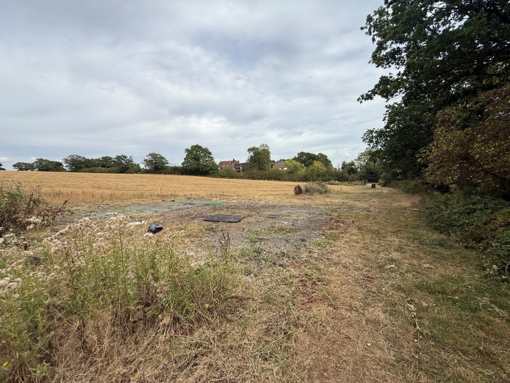 Lot: 43 - LAND WITH PLANNING FOR OVER 50,000 SQUARE FEET OF COMMERCIAL SPACE - View of land from main access